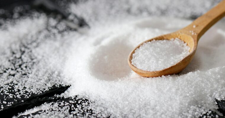 close up shot of a wooden spoon and salt