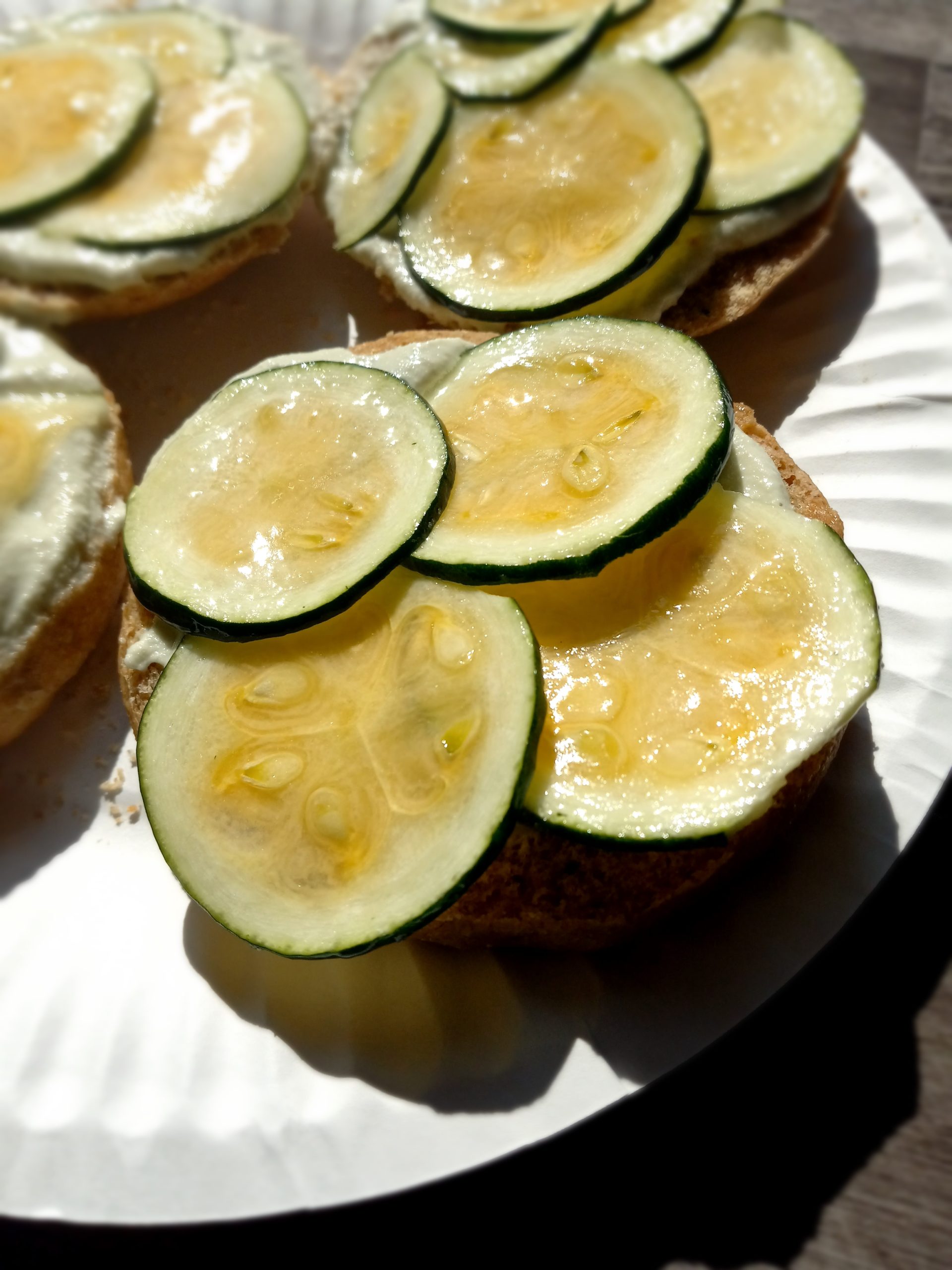 Picture of marinated zucchini on a half of a spelt bun.