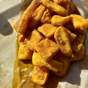 pan-fried chickpea tofu on a brown bag