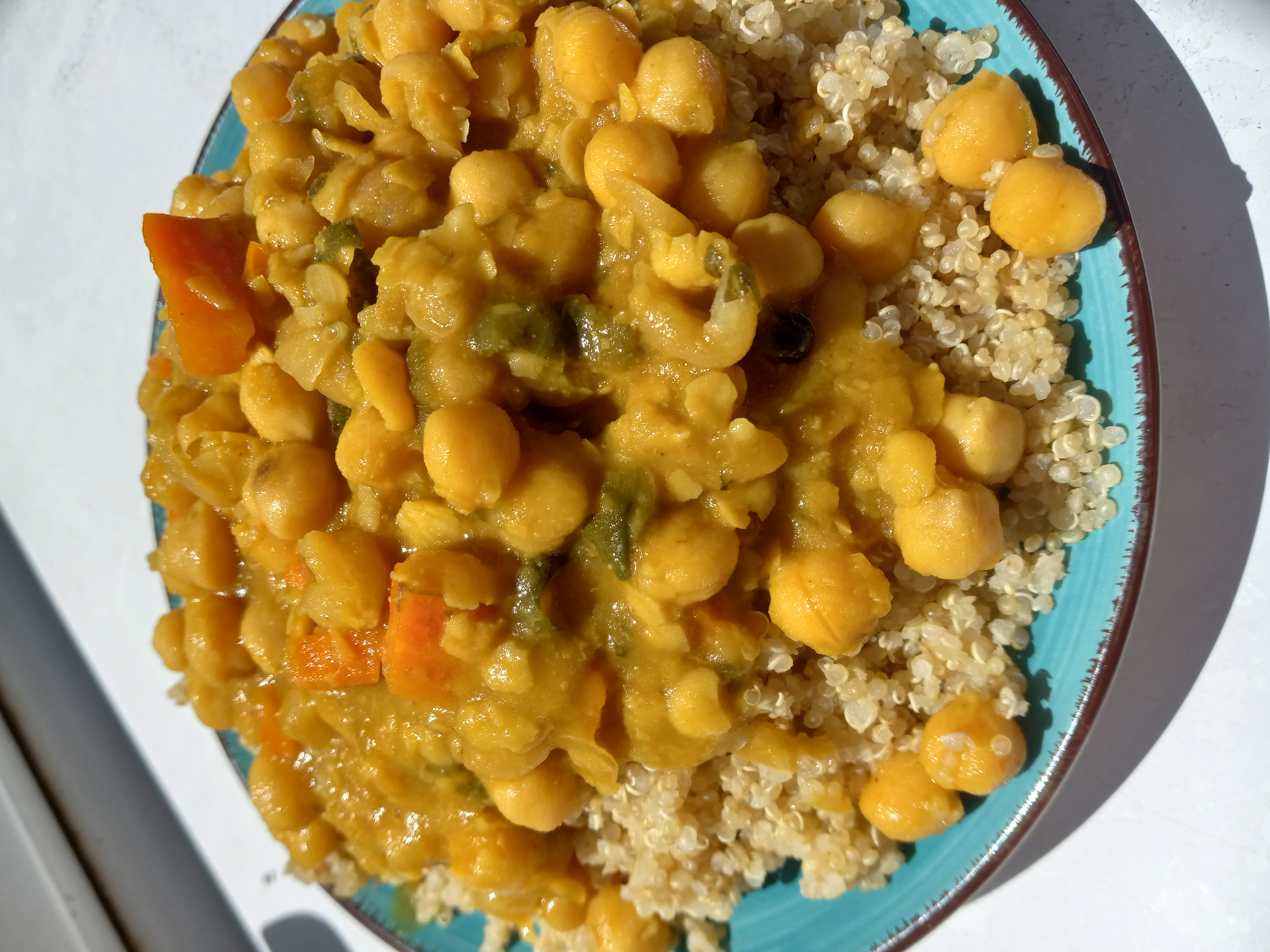 Side view of stewed chickpeas and quinoa.