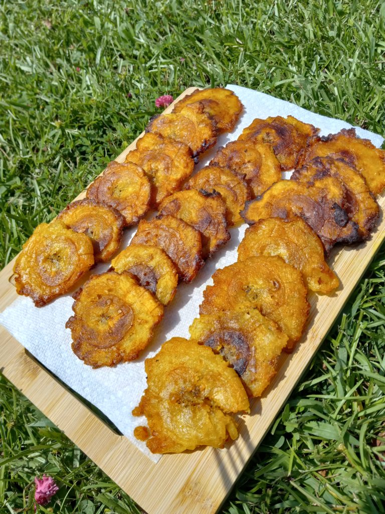 wooden cutting board with tostones