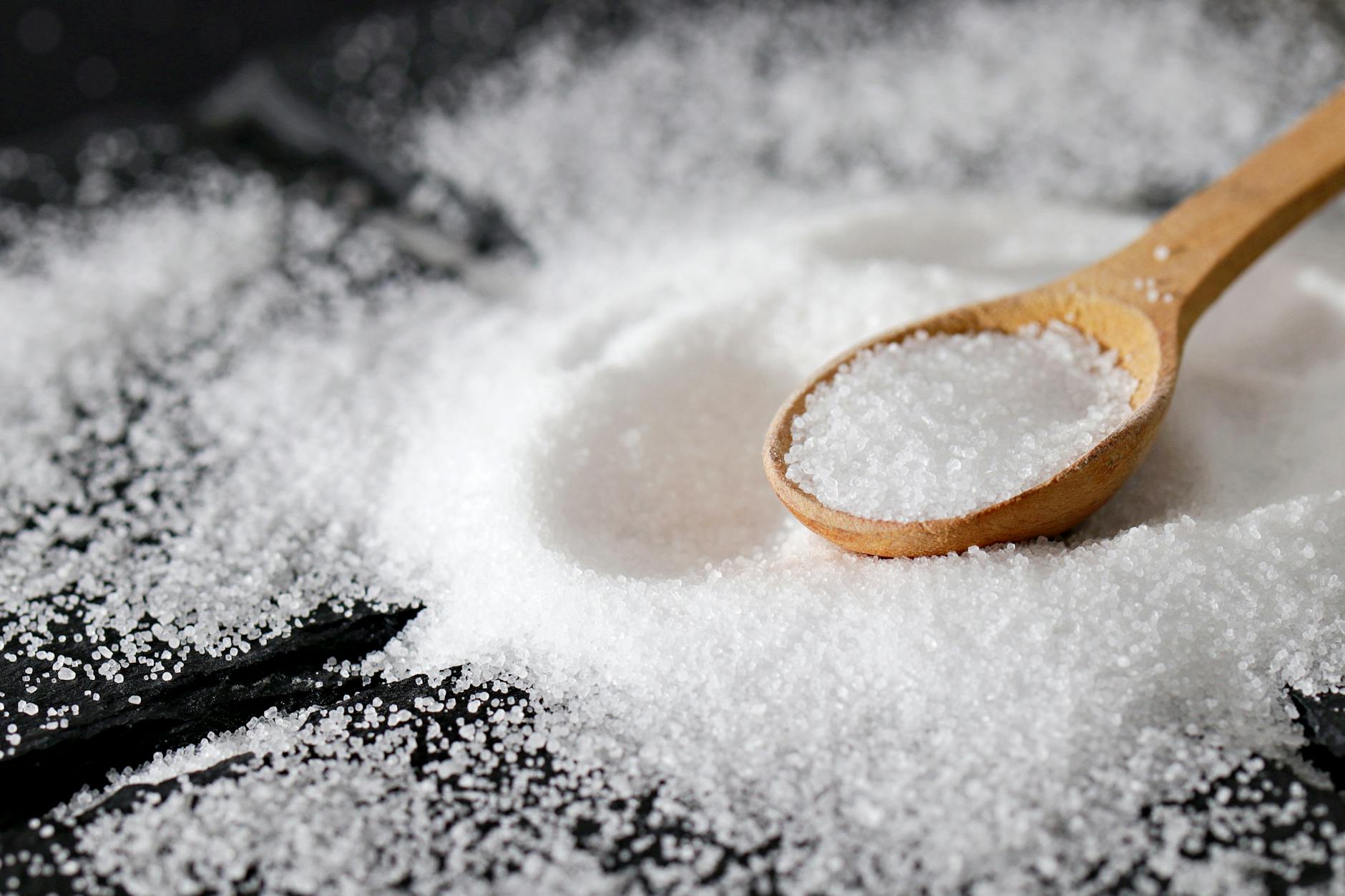 close up shot of a wooden spoon and sea salt