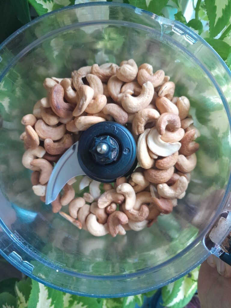 toasted cashew in a food processor with sea salt