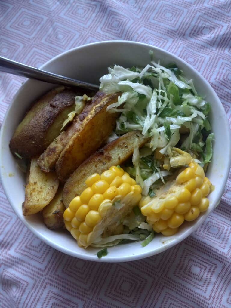 Oven Roasted Potatoes, Steamed Corn, Stewed Chickpeas, and Cabbage Slaw